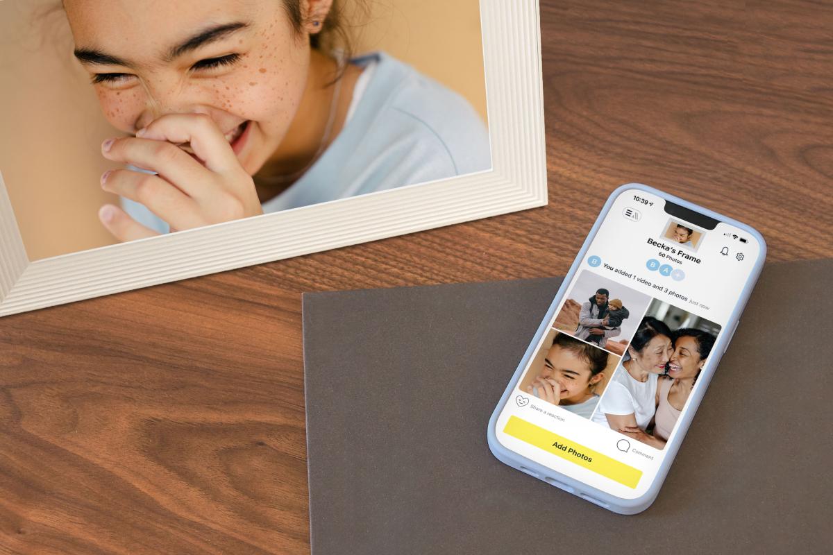 A Carver frame next to iPhone showing the Aura app.