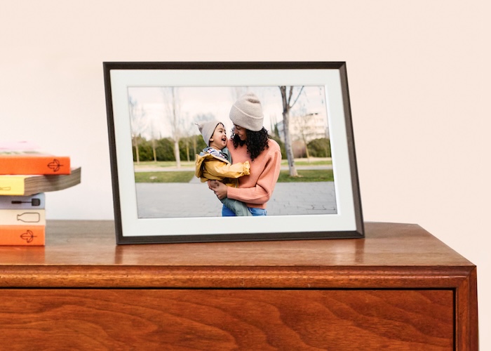 Two frames from The Stone Collection, one in boudler and one in basalt, styled on a dresser